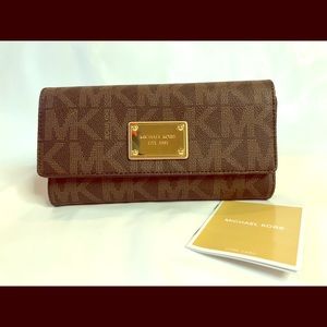 Michael Kors Wallet with checkbook and pen.